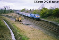 The Ardee branch had lain derelict for 13 years by the time Northern Ireland Railway&#39;s 111 Class loco No.112 was captured heading south through Dromin Jct on the &#39;Enterprise&#39; in March 1988. The digger seen beside the line had been lifting the track on the closed branch. ©Colm O&#39;Callaghan