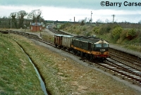 An early 1970s view of Dromin Junction, with a re-engined C Class locomotive No.B203, leading a single covered wagon and a brake van off the Ardee branch heading south towards Drogheda. The passenger station had been closed to passengers since February 1955, although the cabin remained open to control the junction. ©Barry Carse