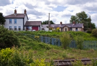The station masters house and railwaymens cottages survive as private residences on the down side of the former Dromin Junction station. The junction for the branch was once sited in the foreground.