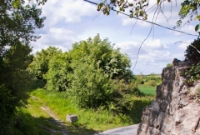 Part of a demolished stone bridge abutment just west of Dromin Jct on the former Ardee branch. The branch was only lifted in March 1988, several years after it had closed completely. Part of the former trackbed nearer Ardee is now a public footpath.
