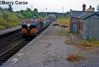 Another early 1970s view sees 181 Class loco No.182 leading a short keg train through the derelict Dromin Jct Station. By this time only a small part of the brick built station building remained. ©Barry Carse