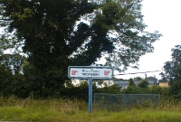 Dromkeen station name board, unusaully the station was given this 1980s T-board sign, still with IR point logos and blue livery, despite the station was closed to passengers for some time.