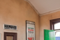 The interior of the restored Cavan &#38; Leitrim Railway station building at Dromod, showing the ticket counter and office.