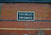 A replica of the one time Great Southern Railway style name board at Dromod Station, depicting the old Irish script.