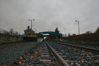 A view from track level looking east towards Dublin at Dromod Station. Today the up platform has been extended along here. On the left can be seen the buffer stop of the former goods siding headshunt.