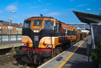 071 Class No.077 is seen leading a loaded timber train through Drumcondra Station. This timber traffic originated in Sligo, and would travel south to Waterford. This timber traffic from Sligo has since ceased.