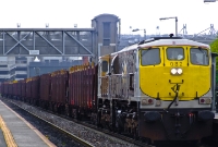 071 Class loco No.082 in its silver &#38; black livery powers the empty North Wall to Sligo empty timber train through Drumcondra. No.082 was built by General Motors in 1976, and entered service with CIE in the summer of 1977.
