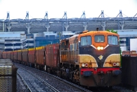 With the stadium of Croke Park in the background, 071 Class loco No.074, with its faded numbers, leads the Sligo bound empty timber wagons through Drumcondra on a miserable morning.