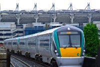 It has stopped raining by the time 22000 Class railcar No.22019 leads the morning 11:05 Dublin to Sligo service through Drumcondra. The parapets beside the line belong to the bridge carrying the line across the Drumcondra Road.