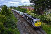 This is the return working of the IWT freight service from Ballina, seen approaching Claude Rd with 071 Class loco No.076 in charge. The train is seen loaded with a mixture of container and tanks.