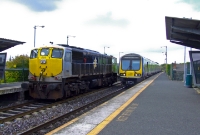 No.086 is glimpsed again, this time passing through the station at Drumcondra as it heads light engine to Inchicore Works having deposited the IWT liner in the North Wall freight yard, while 29000 Class railcar No.29429 arrives with a service from Maynooth.