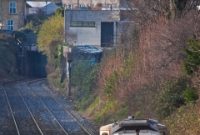 Loco No.076 gains a clear signal on the &#39;up&#39; line towards Drumcondra as it heads light engine from Inchicore Works to the North Wall yards. Glasnevin Station was once sited between the signals in the background, the furthest indicating a clear aspect for a Sligo bound train.