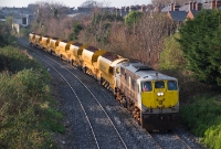 Taking a rake of Irish Rail&#39;s newish auto-ballaster wagons past Claude Rd is 071 Class loco No.080, heading empty to the North Wall yard having discharged its load on the Sligo line.