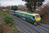 A smart looking ex-works 201 Class loco No.234 brings the IWT liner from Ballina past Claude Rd having recently been outshopped from Inchicore Works. On this occasion the IWT liner is formed of the pocket container wagons.