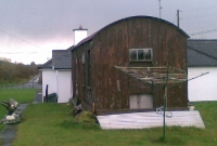 View of the wooden waiting shelter, with the much expanded crossing keepers house behind.