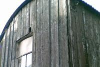 Closer detail of the wooden waiting shelter at Drumawnagh Station, with original window pane.