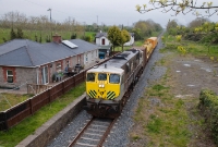 Duleek closed in April 1958 and the station is now a private residence. 071 Class locomotive No.073 passes by with Irish Rail&#39;s annual weed spraying train, en route from Drogheda to Navan. The vacant land to the right was once occuped by a siding and goods loading bank.