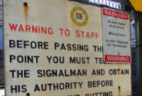 An old CIE warning sign for permanent way workers at the south end of Dun Laoghaire Station, where the lengthy cutting to Sandycove commences.