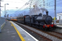 Seen passing the ferris wheel at the north end of Dun Laoghaire is ex Great Southern &#38; Western Railway&#39;s J15 Class 0-6-0 No.186, heading a Railway Preservation Society of Ireland special to Wicklow. The carriage behind No.186 is No.1142, was built in 1921 by the GSWR at Inchicore Works, and is a &#39;1st Class Corridor&#39;.