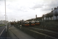 An early 1970s view of the northern end of Dun Laoghaire Station, with a line up of three re-engined C Class locomotives Nos.B210, B213 and B206. To the left of the picture can be seen a covered wagon parked on Coal Quay siding which crossed the adjacent road at right angles. ©Barry Carse