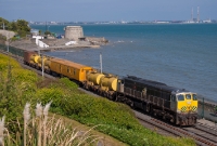 Viewed at a higher elevation to the previous year, Irish Rail&#39;s annual weed spraying train passes Seapoint with 071 Class loco No.079 at the healm, seen heading south for Bray on a calmer day.