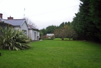 This is Dunboyne Station in December 2004, looking north towards Navan from the south end of the station. On the left is the single storey station building, located on what was the former up platform.