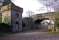 A more clearer view of the road overbridge, water tower, and the station building at Dunboyne in February 2009. The structures date from the lines opening in 1862.