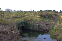 Another view of this small stone built culvert bridge, located just north of Dunboyne. As can be seen in this 2009 view, the trackbed of the former line was gradually been cleared of vegetation. In the very distance the R167 road overbridge can just be seen, which was subsequently demolished during the rebuilding of the line.
