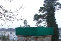 Some details on the MGWR water tower at Dunboyne Station; the green painted metal hook beside door entrance helped hold the one time water bag which was attached to the protruding metal pipe below the portal window.