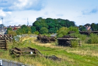 Another shot of the short remnent of the Barrack St branch, viewed from the disused South Jct. The track is covered entirely by grass. This area is used for storing redundant track materials.