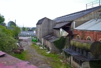 The trackbed of the D&#38;G line beside the GNR works. The line continued straight across the Great Northern&#39;s main line towards Barrack Street, the metal fencing marks the site of the square crossing.