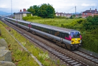 A southbound &#39;Enterprise&#39; is seen heading out of the station at Dundalk and approaches the Ardee Rd bridge adjacent to the former square crossing.