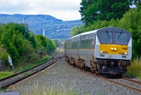 This is the view looking towards Belfast from the north end of Dundalk Station, with the hills and mountains of Slieve Gullion range visible in the background. De Dietrich &#39;Enterprise&#39; DVT No.9002 approaches with a service from Belfast.