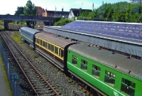 A range of preserved vintage RPSI coaches are seen stabled in the bay platform at the south end of Dundalk Station. The middle carriage is a 1902 built Great Southern &#38; Western Railway state saloon coach No.351.
