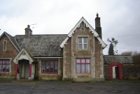 The somewhat gothic station building at Dundrum, seen from the station forecourt. The wooden gable boards give the station some charm.