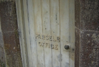 This door on the railway side of Dundrum Station still retains its wooden stencils, for the one time parcel office.