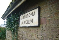 Despite having closed to passengers in 1976, the wooden CIE name board is still mounted onto the side of Dundrum station building. The station was still the scene of activity until it ceased to be a signalling block post in 1987.