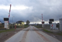 South of Dundrum village on the R497 road is the unremarkable level crossing at Grange. It was here in 1962 that the first automatic level crossing was installed on an Irish railway. The half barriers seen here, which had been the type used since 1962, have been replaced by full barriers that span the width of the road.