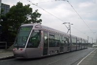 Luas tram No.4009 stands on a dull day at the new Luas stop at the former railway station at Dundrum. Nowadays these French built trams feature a yellow warning band around their surrounds to aid visibility while traversing the street sections of the line in Dublin City.