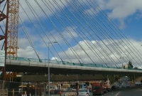 This is a similar view but with the new Luas line bridge in situ. Originally this road did not exist in railway days. The former bridge and embankment were removed following the closure of the railway line in December 1958.