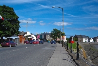 The stretch of greenery on the right marks the former railway trackbed as it crossed the N25 road in the foreground. When the line closed in 1967, the section along here into Dungarvan Station was retained until 1970 as the town was used as a base for the track lifting gang.