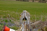 The remaining concrete made crossing gate post at Toolobaun level crossing south of Dunsandle Station.