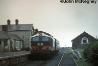 B220 is seen again at Dunsandle in early 1975, this time with a single coach working to Loughrea. On the right is the goods siding and shed. ©John McKegney