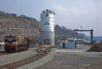 A panoramic view of Waterford West freight yard, which is located just west of the passenger station. On the left is loco No.080 with a timber train, behind is the cement silo, and to the right is the 1975 constructed gantry, now disused.