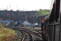 The view from a train on the western approach to Waterford West itself. In front of the locomotive can be seen the bracket semaphore signal; the right hand pole minus its arm once controlled the Dungarvan/Mallow line. Waterford West signal cabin can be seen beyond.