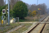 This is a Newrath automatic level crossing, located near Waterford West. The rusty disused track on the left are the remains of the line to Mallow which was closed in 1967, although the section to Ballinacourty remained open until 1982; it was last used in 1990. The nearest track is to Limerick.