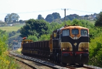 A tired looking 071 Class loco No.084 propels an empty ballast train along the Limerick to Waterford line near Waterford West.