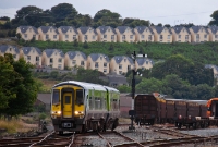 Approaching Waterford Station from the west are 2700 Class railcar units Nos.2726+2723, forming a Limerick to Rosslare Harbour service. Behind can be seen an empty rake of timber wagons, having been unloaded earlier.