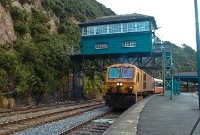 In 2002, 201 Class locomotive No.222 takes an evening Waterford to Dublin service out of Waterford, seen passing beneath the well known elevated Waterford Central signal cabin.