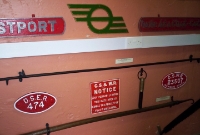 Inside the MGWR waiting room on the down platform is a small museum, featuring some name plates and other railway artifacts.